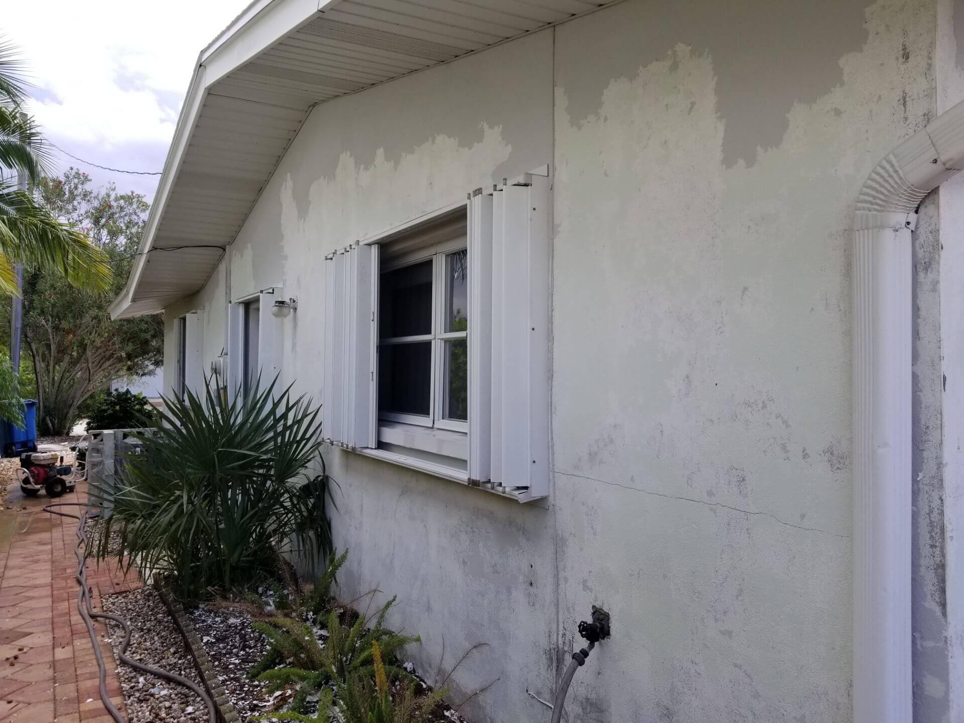 the side of the house as peeling paint 